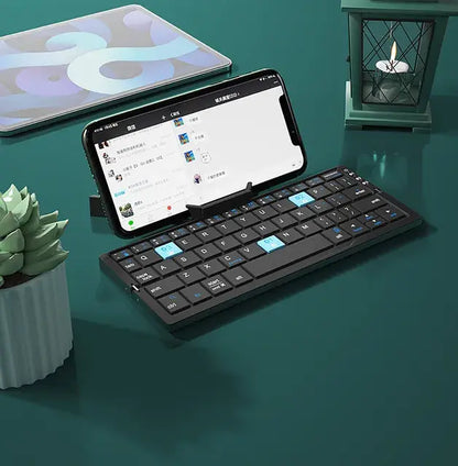 JOMAA Compact Wireless Keyboard - Portable, Foldable Design with Built-in Stand for Phones & Tablets